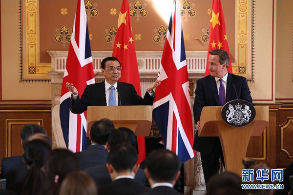     6月17日，國務(wù)院總理李克強(qiáng)同英國首相卡梅倫在倫敦舉行中英總理年度會晤后共同會見記者。 新華社記者 龐興雷 攝 