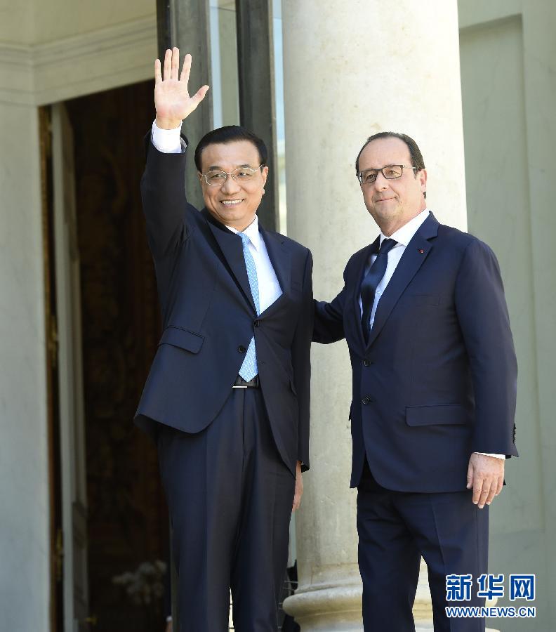 當?shù)貢r間6月30日下午，中國國務院總理李克強在巴黎愛麗舍宮會見法國總統(tǒng)奧朗德。 新華社記者李學仁攝 